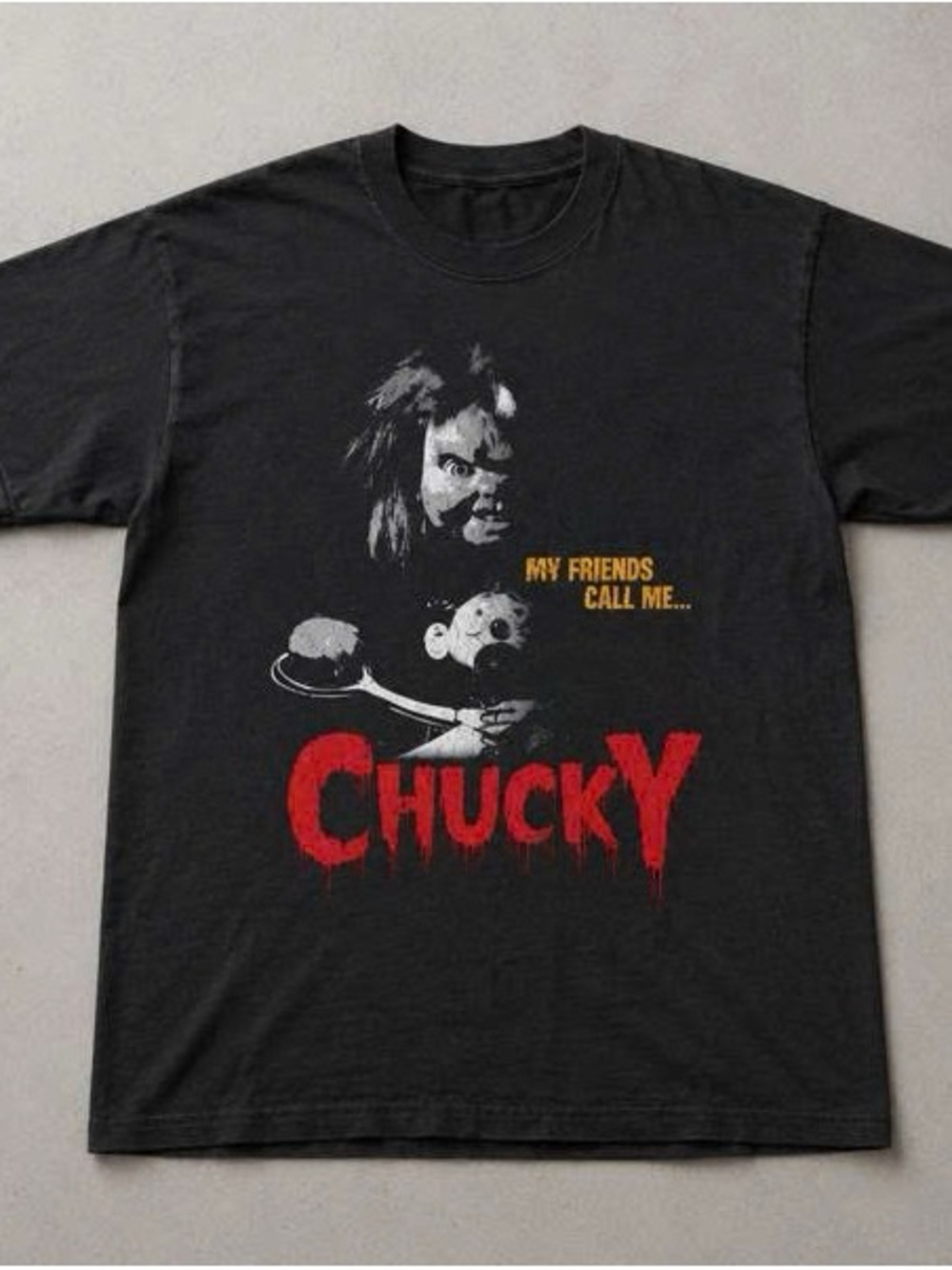 Black Chucky Graphic Tee with Red and Yellow Print